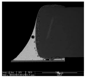 Figure 3 Cross sectional results of the bottom of a component pad that has detached from the surface Figure 3 Cross sectional results of the bottom of a component pad that has detached from the surface